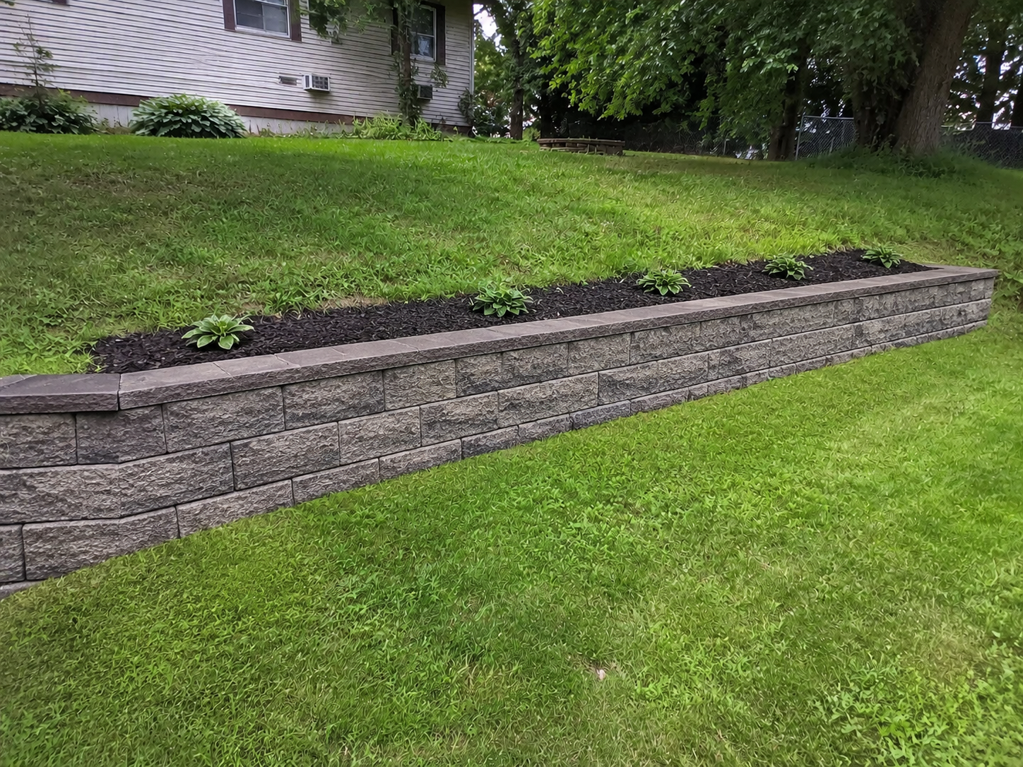 Generated example of the same area with a finished block retaining wall
