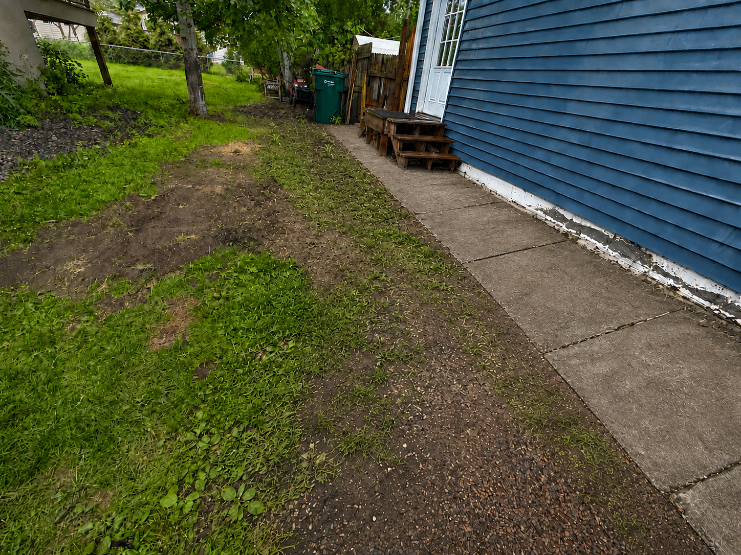 Recreated view of the old concrete sidewalk flush against the house before replacement